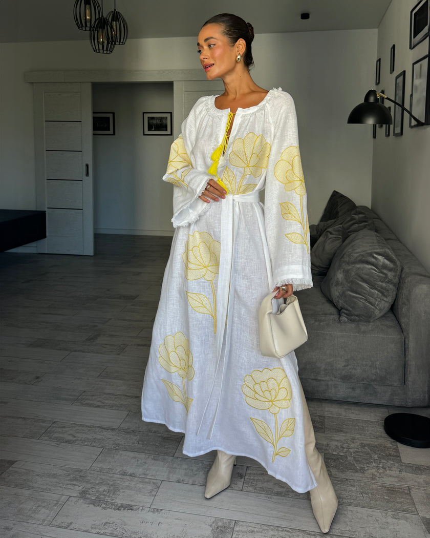 White linen kaftan maxi dress with yellow outlined floral embroidery and angel sleeves styled with handbag - Zalxndra Resort