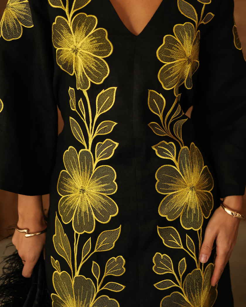 Close-up of bold gold floral embroidery on black linen kaftan maxi dress - Zalxndra Resort