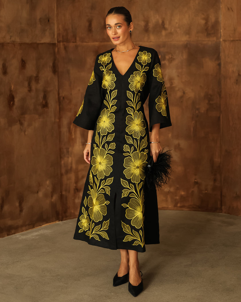 Full-length view of black linen kaftan maxi dress with bold gold floral embroidery, V-neck, flared sleeves, and front slit - Zalxndra Resort