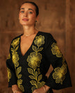 Portrait view of black linen kaftan maxi dress with bold gold floral embroidery, V-neck, and flared sleeves - Zalxndra Resort