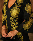Sleeve and bodice detail of black linen kaftan maxi dress with bold gold floral embroidery and V-neck - Zalxndra Resort