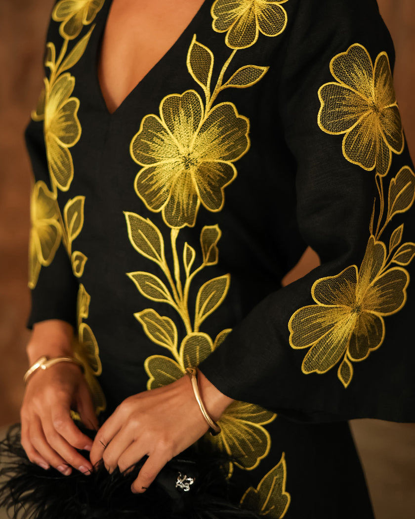 Sleeve and bodice detail of black linen kaftan maxi dress with bold gold floral embroidery and V-neck - Zalxndra Resort