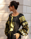 Black linen kaftan maxi dress with gold geometric embroidery, balloon sleeves and gold tassel ties, bodice detail view - Zalxndra Resort