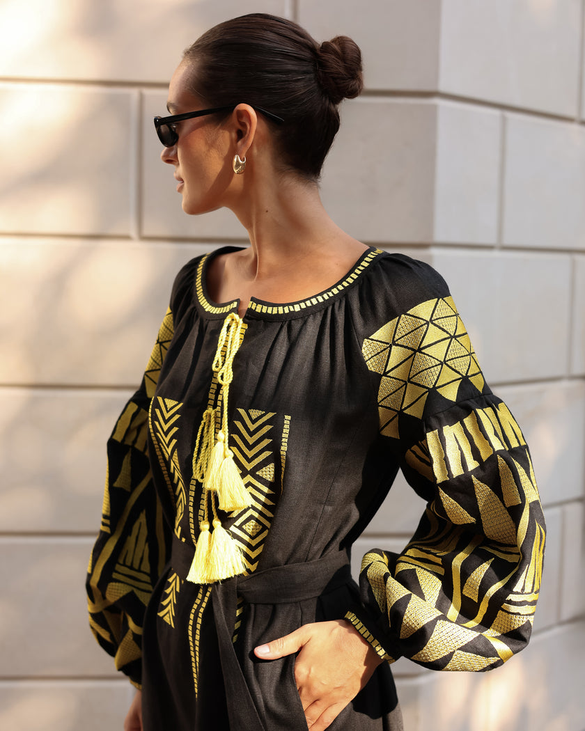 Black linen kaftan maxi dress with gold geometric embroidery, balloon sleeves and gold tassel ties, bodice detail view - Zalxndra Resort