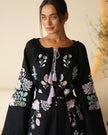 Bodice detail of black linen kaftan maxi dress with pastel floral embroidery and lilac tassel ties - Zalxndra Resort