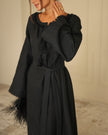 Bodice detail of black linen kaftan maxi dress with frayed neckline, tassel ties, and tonal floral embroidery - Zalxndra Resort