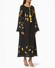 Black linen kaftan maxi dress with yellow and orange leaf embroidery, angel sleeves with frayed trim, yellow tassel ties and self-tie belt, front view - Zalxndra Resort