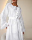 Sleeve and bodice detail of white linen kaftan maxi dress with tonal floral embroidery, frayed bell sleeves, and tassel ties - Zalxndra Resort