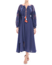 Model styled in navy linen kaftan maxi dress with orange and blue geometric embroidery, balloon sleeves, and tassel ties - Zalxndra Resort