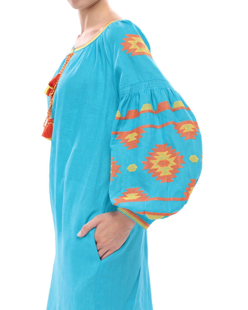 Sleeve detail of turquoise linen kaftan midi dress with orange and yellow geometric embroidery and tassel ties - Zalxndra Resort