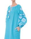 Bodice and sleeve detail of turquoise linen kaftan midi dress with white geometric embroidery and tassel ties - Zalxndra Resort