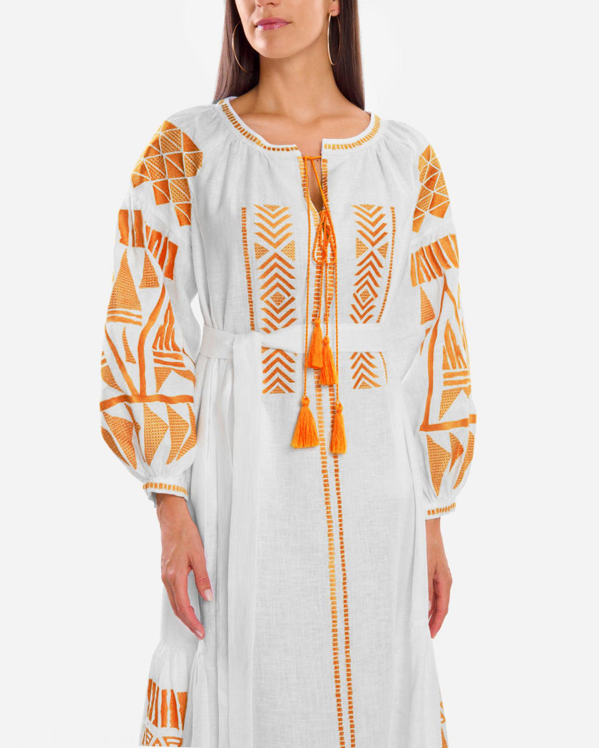 Bodice detail of white linen kaftan maxi dress with orange geometric embroidery, balloon sleeves, and tassel ties - Zalxndra Resort