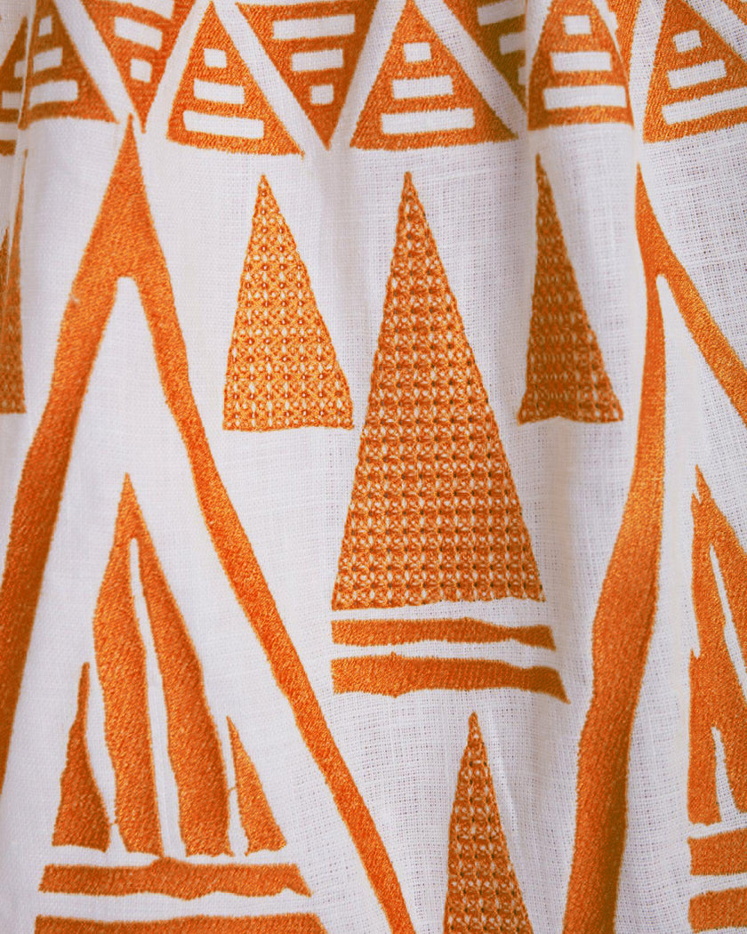 Close-up of orange geometric triangular embroidery on white linen kaftan maxi dress - Zalxndra Resort