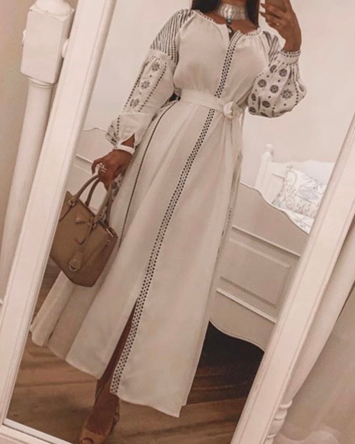 White linen kaftan maxi dress with slate geometric embroidery, balloon sleeves, button closure and self-tie belt, mirror lifestyle view - Zalxndra Resort