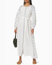 White linen kaftan maxi dress with slate geometric embroidery, balloon sleeves, button closure and self-tie belt, styled with green handbag - Zalxndra Resort