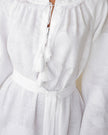 Close-up of tonal white floral embroidery and tassel ties on linen kaftan maxi dress - Zalxndra Resort