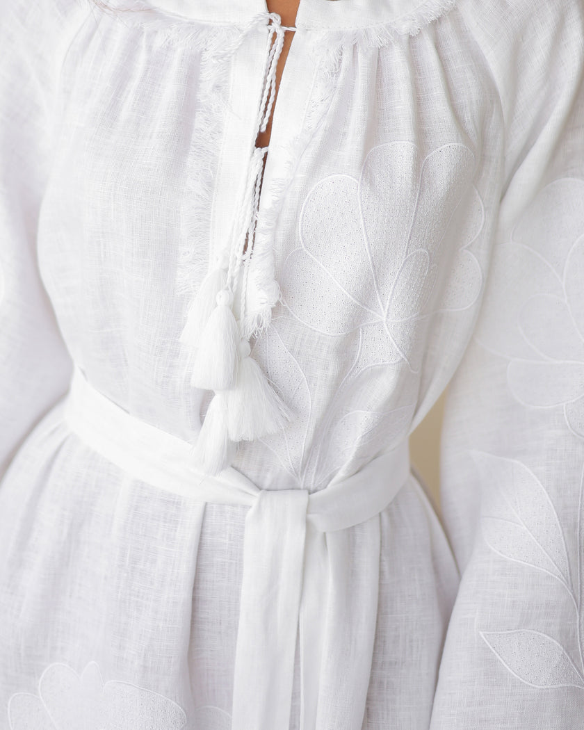 Close-up of tonal white floral embroidery and tassel ties on linen kaftan maxi dress - Zalxndra Resort