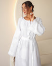 White linen kaftan maxi dress with tonal floral embroidery and frayed bell sleeves styled portrait - Zalxndra Resort