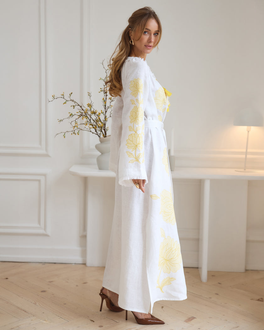 Side view of white linen kaftan maxi dress with yellow floral embroidery and angel sleeves - Zalxndra Resort