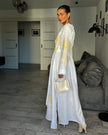 Back view of white linen kaftan maxi dress with yellow outlined floral embroidery and angel sleeves - Zalxndra Resort
