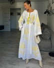White linen kaftan maxi dress with yellow outlined floral embroidery, angel sleeves, and tassel tie - Zalxndra Resort